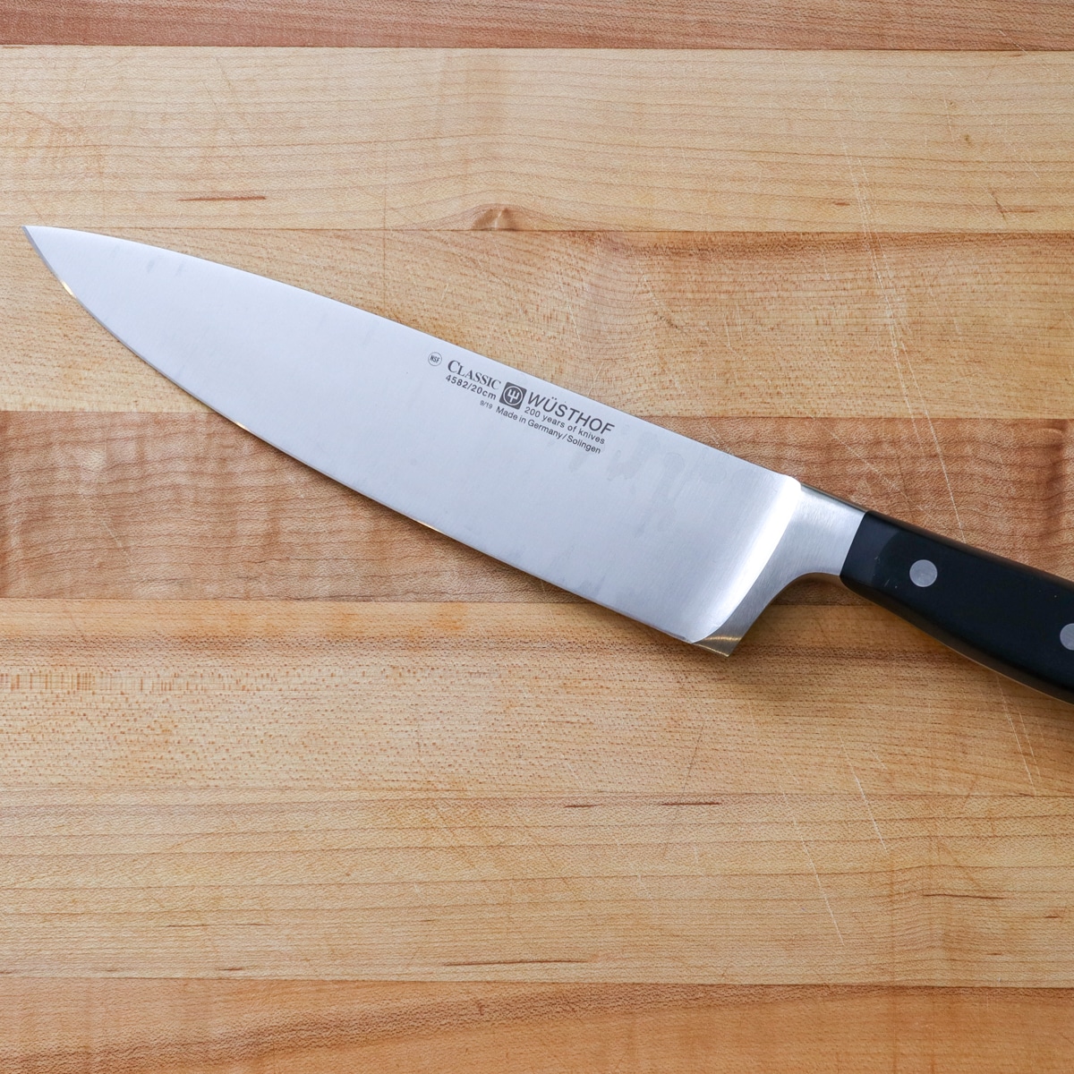 chef knife on a cutting board
