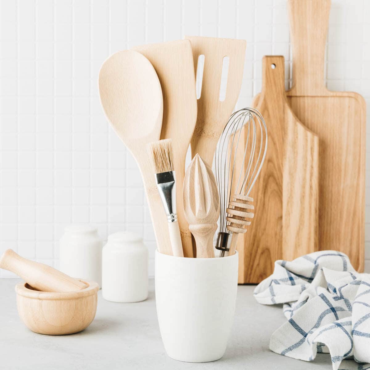 Essential cooking tools on a white counter