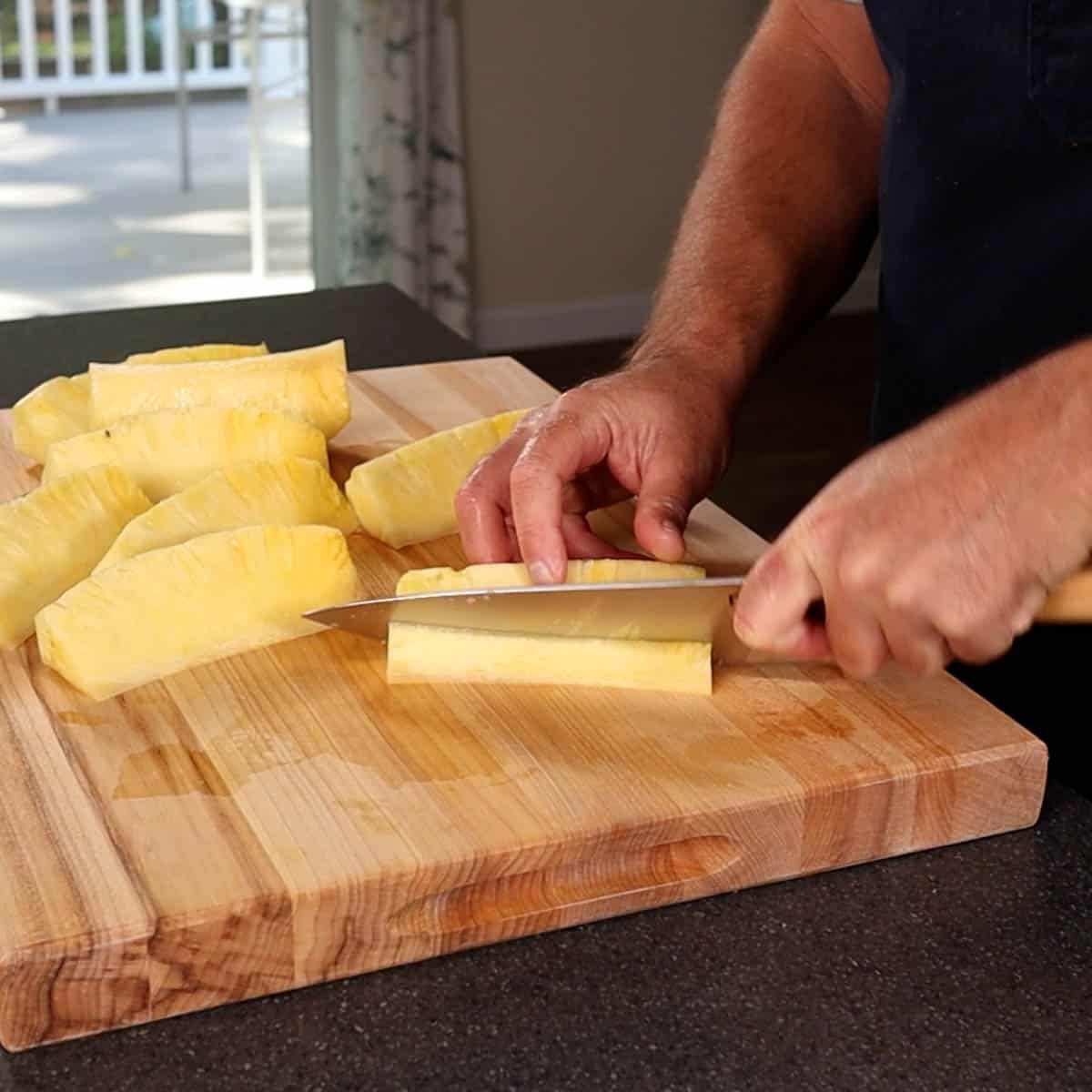Cutting the core out of the pineapple