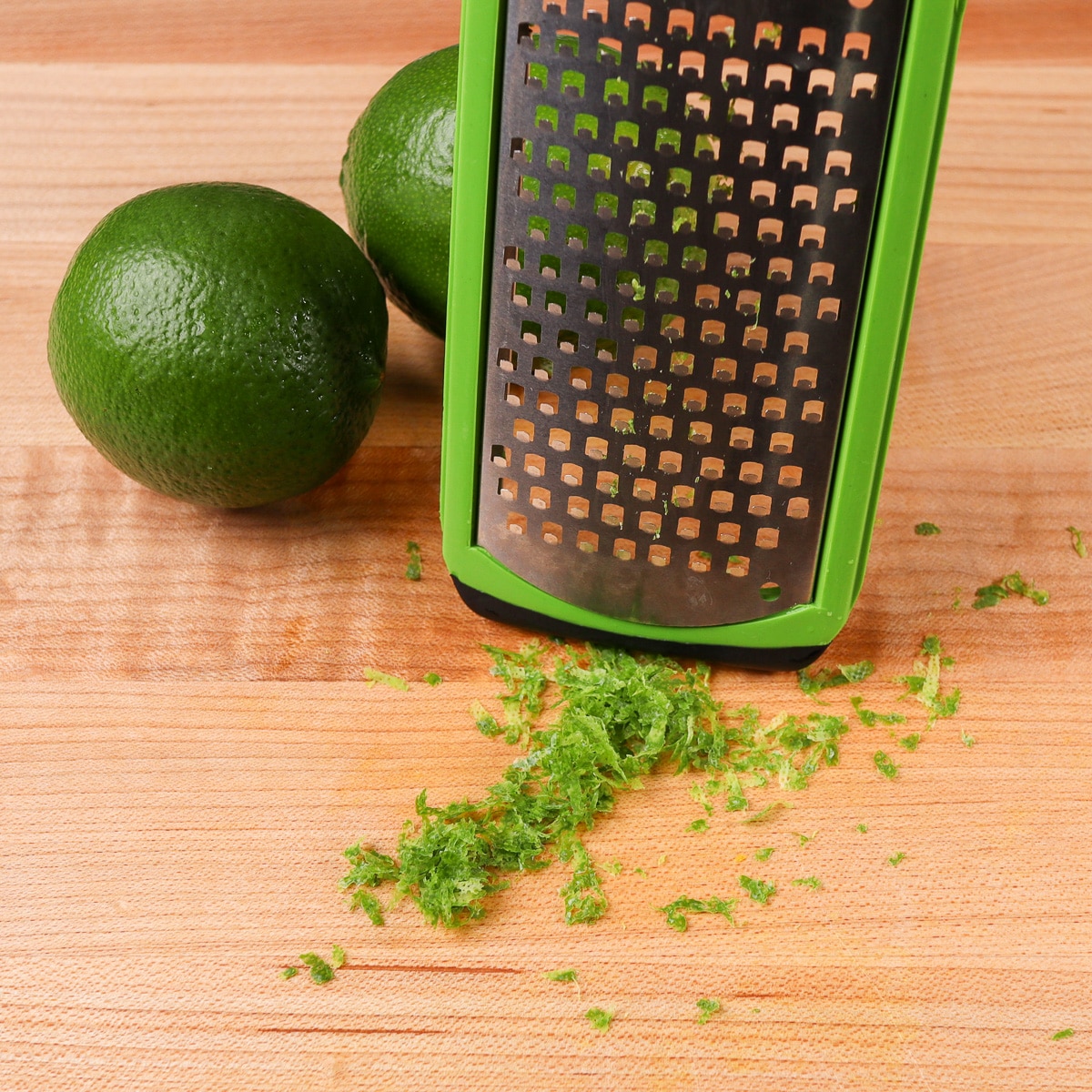 lime zest in front of a zester
