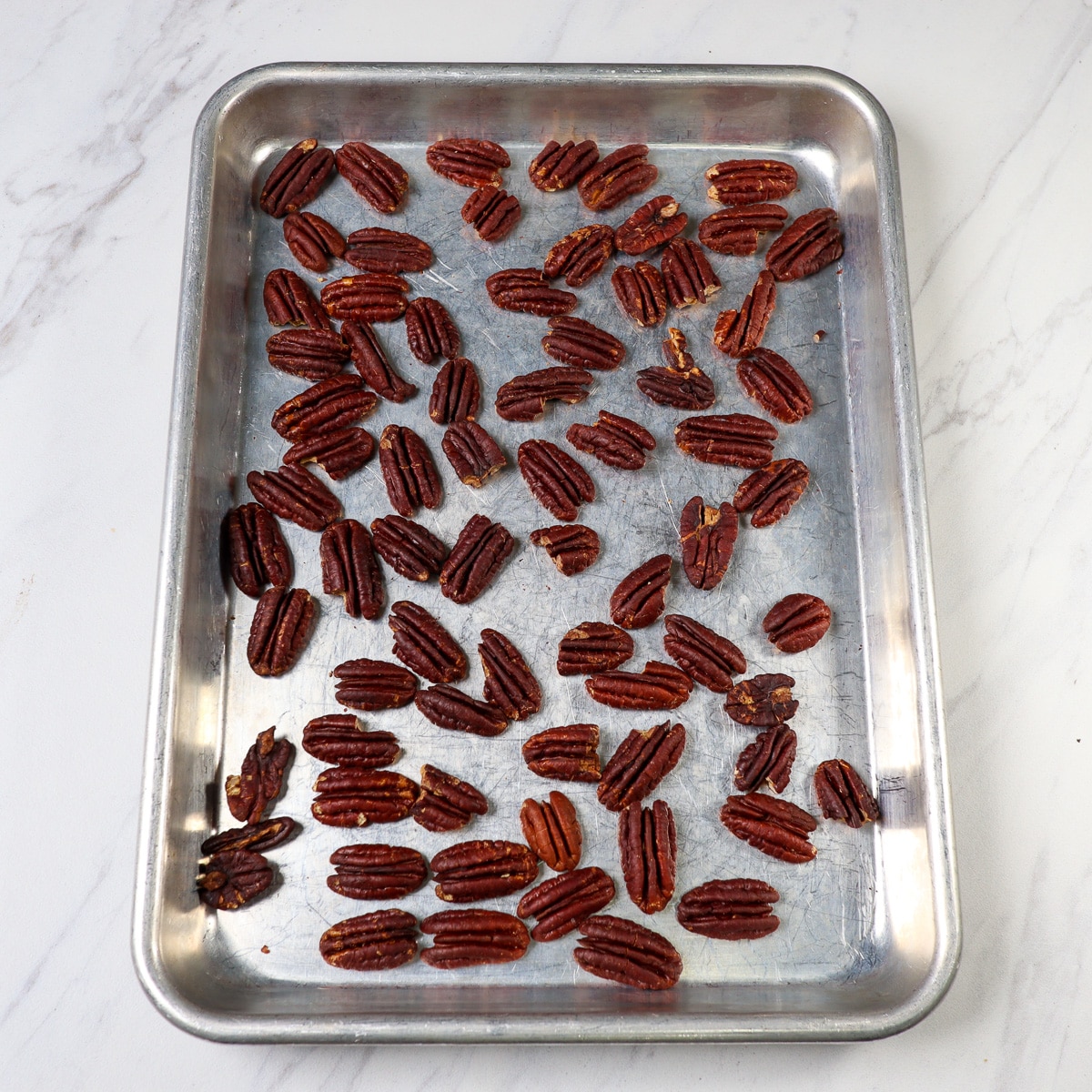 toasted pecans on a sheet pan