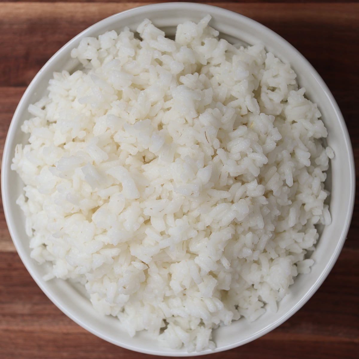 white rice cooked in a bowl from the stove top
