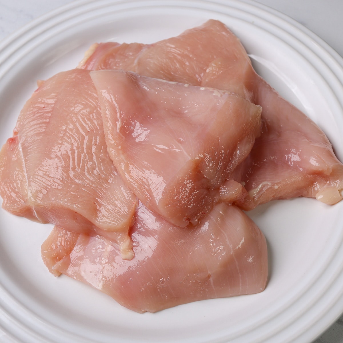 chicken breast sliced in half to make them not as thick
