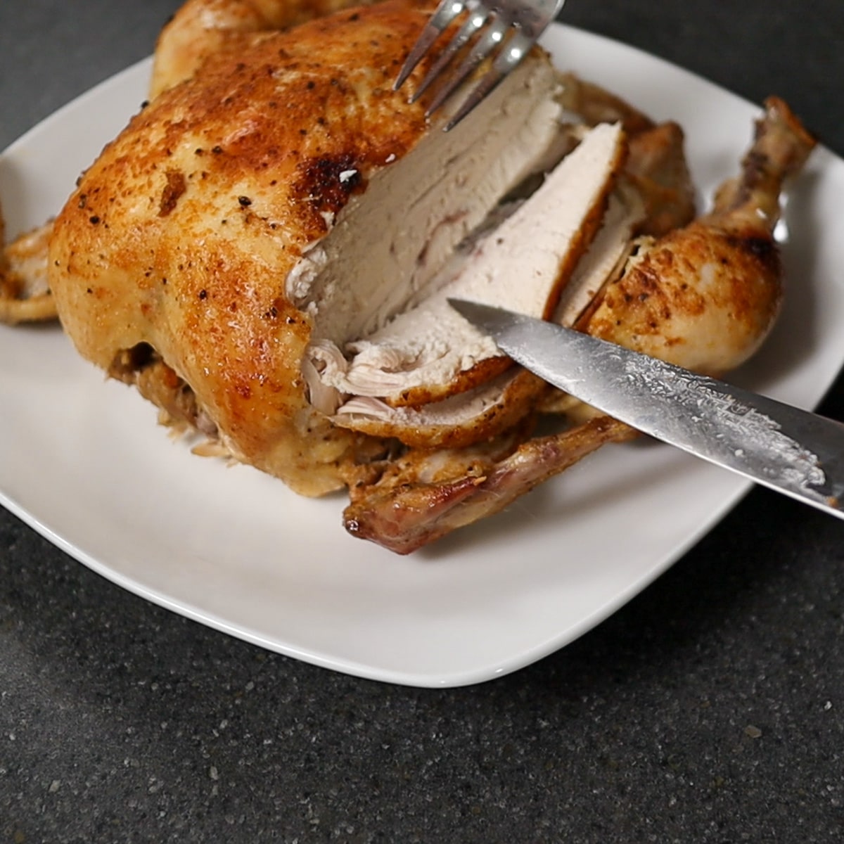 chicken being sliced