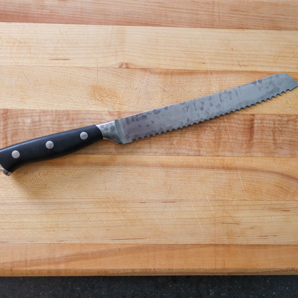 Serrated knife on a cutting board
