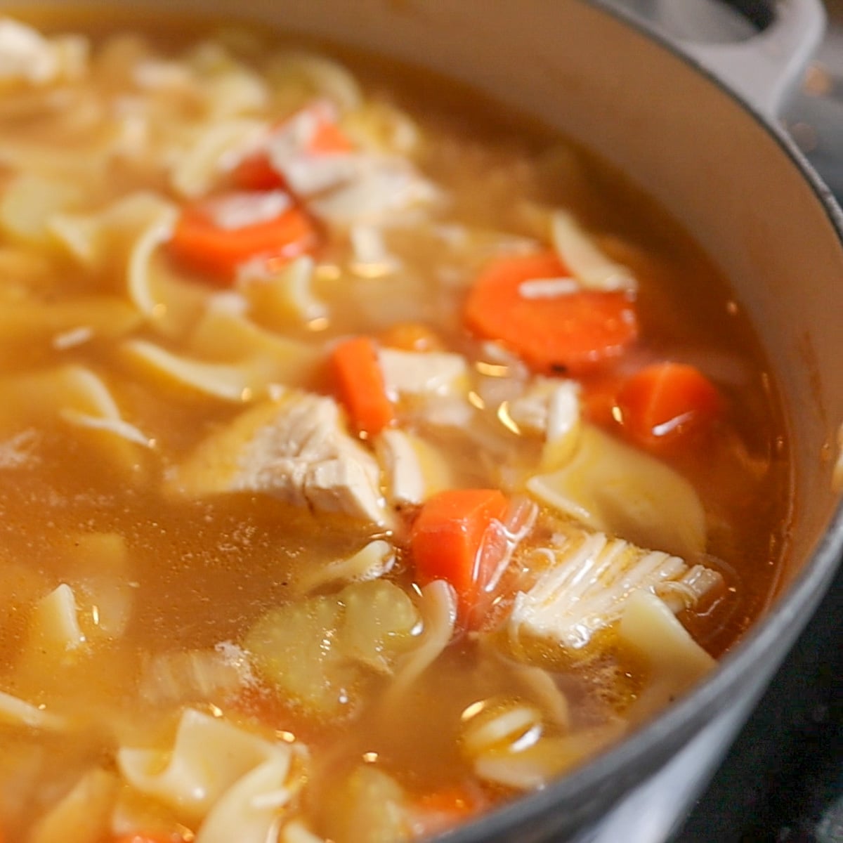 Pot of hearty chicken noodle soup.